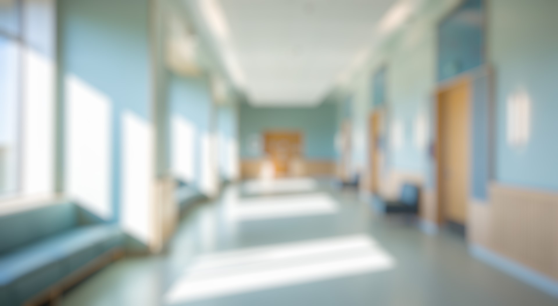 Empty clinic hallway representing wait times